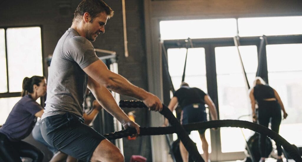 Man training with ropes on CrossFit training