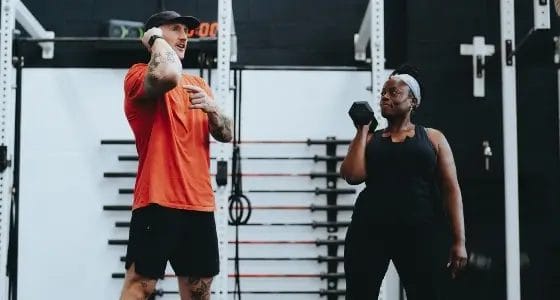 Woman working out with coach